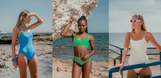 Tre kvinder i Copenhagen Cartel badedragter, bikini og one-piece, stående i solen på en stenet strand.